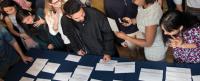 Students checking residency match results.